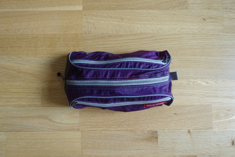 Bathroom bag packed with toiletries packed into Minaal Carry-on