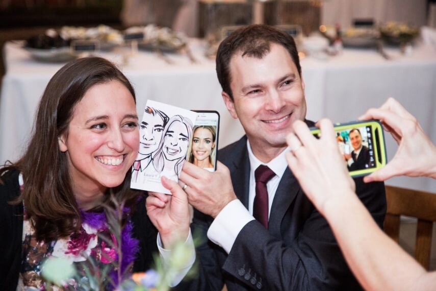 Drawing Booth Clients Having their pictures taken with their portraits